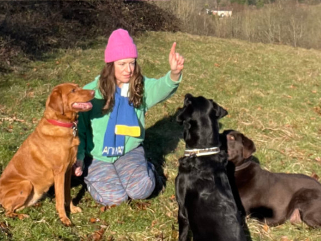 Dog walker Lucy Melzer with group of dogs
